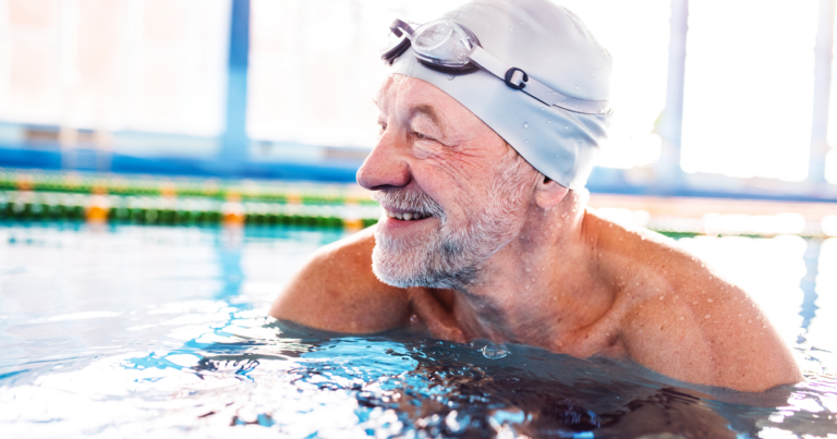 Elderly man enjoying swimming activities