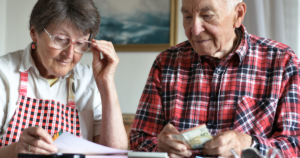 Elderly couple reviewing finances