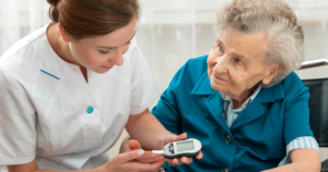 Caregiver assisting a senior with diabetes